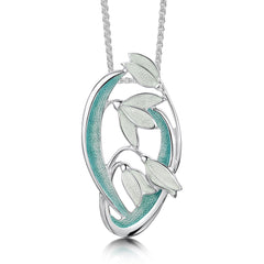 This Snowdrop pendant features four delicate snowdrops framed by curving leaves and stems. The sterling silver piece is hand-enamelled in 'Leaf' enamel.