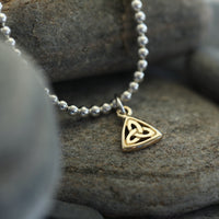 Book of Kells Silver Stretch Bracelet with 9ct Yellow Gold Small Charm by Sheila Fleet Jewellery