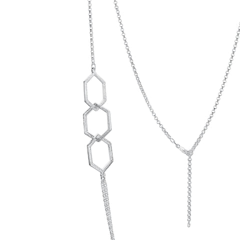This long, sterling silver Honeycomb necklace features six textured hexagons, interlinked in groups of three and separated by long, draping lengths of silver chain.