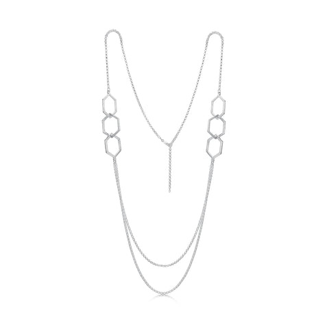 This long, sterling silver Honeycomb necklace features six textured hexagons, interlinked in groups of three and separated by long, draping lengths of silver chain.