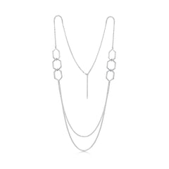 This long, sterling silver Honeycomb necklace features six textured hexagons, interlinked in groups of three and separated by long, draping lengths of silver chain.