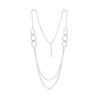 This long, sterling silver Honeycomb necklace features six textured hexagons, interlinked in groups of three and separated by long, draping lengths of silver chain.