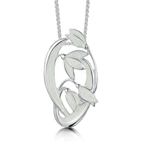 This Snowdrop pendant features four delicate snowdrops framed by curving leaves and stems. The sterling silver piece is hand-enamelled in 'Crystal' enamel.