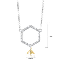 This sterling silver Honeycomb necklace features a small textured hexagon suspended between a silver chain. A small honeybee in 9ct yellow gold hangs from the hexagon.